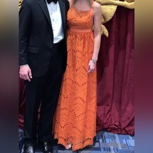 Beautiful eyelet/lace evening gown with bow tie in the back.